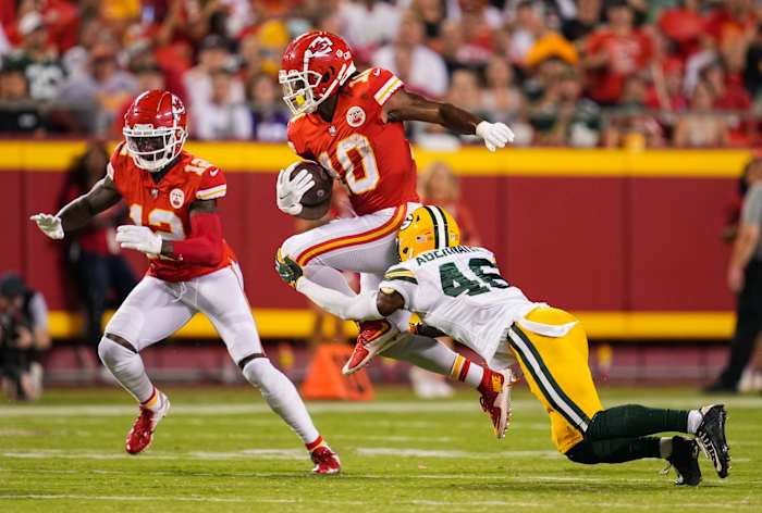 Aug 25, 2022; Kansas City, Missouri, USA; Kansas City Chiefs running back Isiah Pacheco (10) is tackled by Green Bay Packers safety Micah Abernathy (46) as Kansas City Chiefs wide receiver Josh Gordon (12) looks to block during the second half at GEHA Field at Arrowhead Stadium. Mandatory Credit: Jay Biggerstaff-USA TODAY Sports